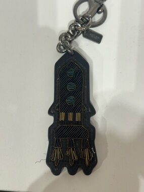 Coach NASA Black and Gold Leather Keychain Charm with Teal Accents